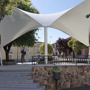 tensile cover with the shape of a hyperbolic paraboloid that covers the square of the town hall 